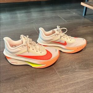 Nike ZoomX Running Sneakers with Orange Swoosh and Neon Yellow Accent